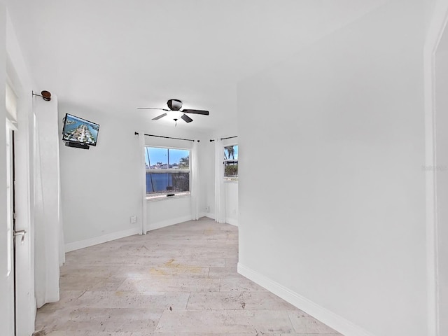 unfurnished room featuring light hardwood / wood-style floors and ceiling fan