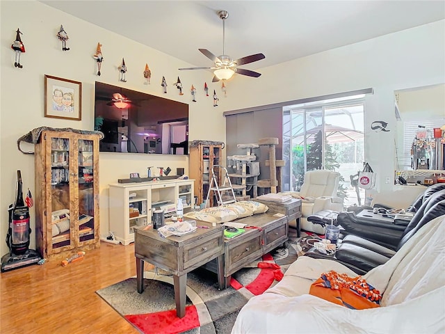 living room featuring hardwood / wood-style flooring and ceiling fan