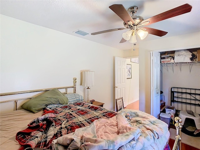 bedroom featuring ceiling fan and a closet