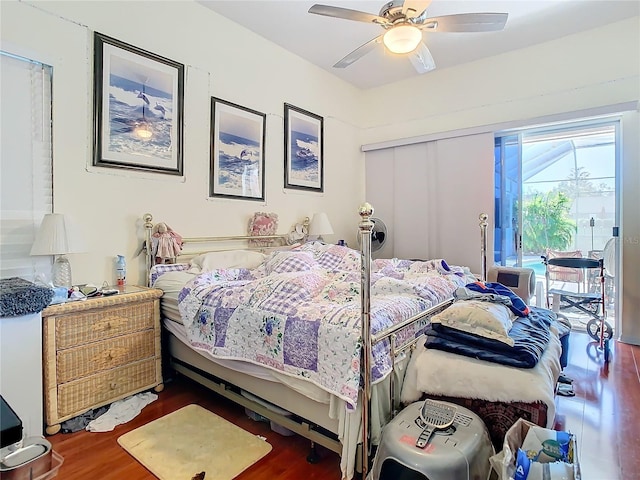 bedroom featuring ceiling fan and dark wood-type flooring