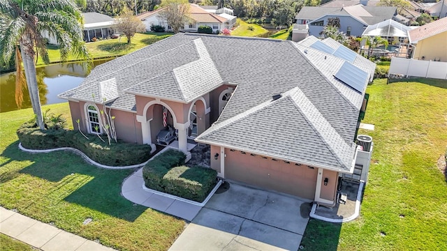 bird's eye view featuring a residential view and a water view