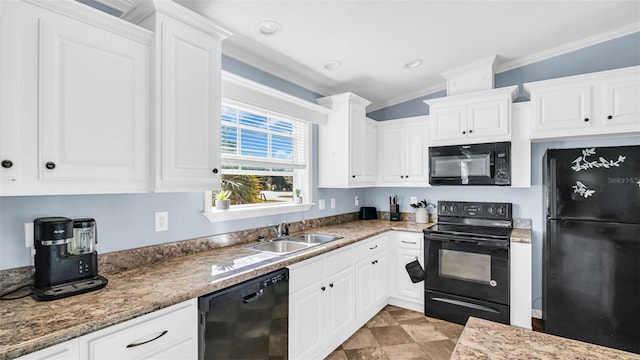 kitchen featuring black appliances, white cabinets, ornamental molding, and sink