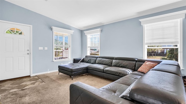 carpeted living room featuring crown molding, a healthy amount of sunlight, and vaulted ceiling