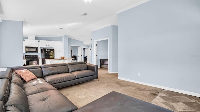 carpeted living room with crown molding and lofted ceiling