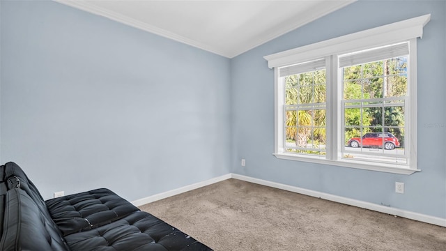 unfurnished room featuring carpet, vaulted ceiling, and ornamental molding