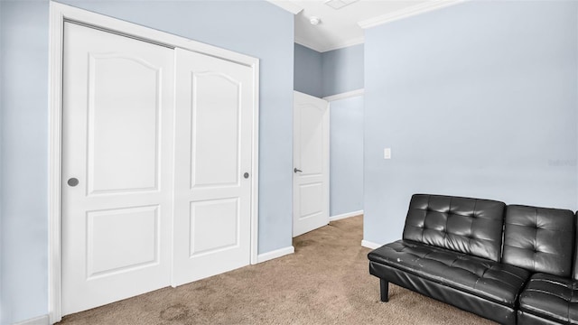 sitting room with light colored carpet and ornamental molding