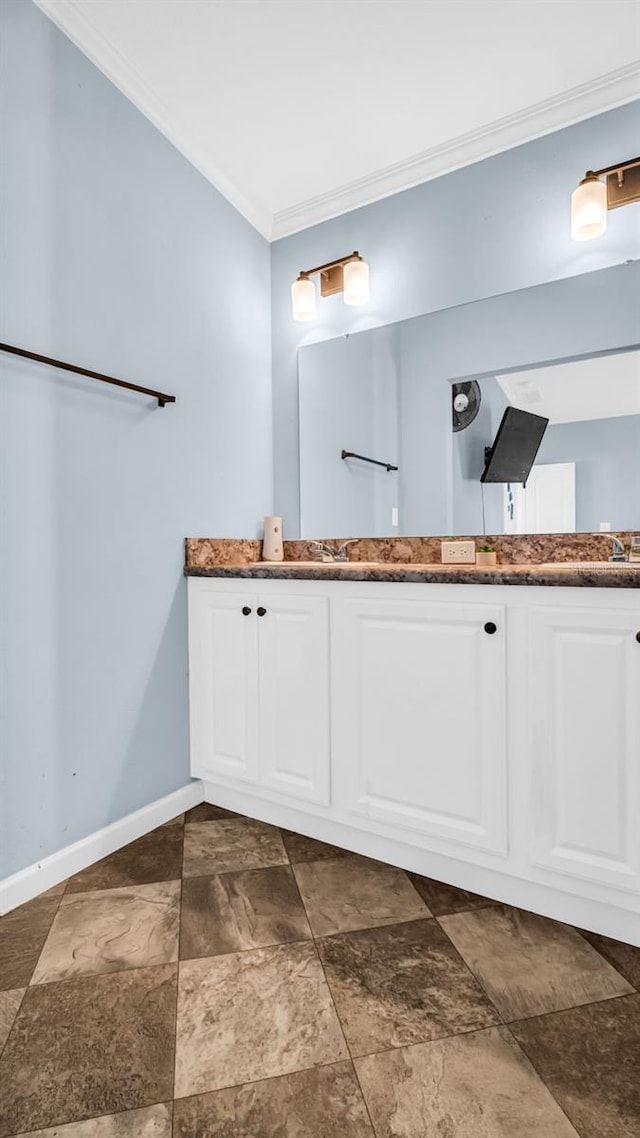 bathroom with vanity and ornamental molding