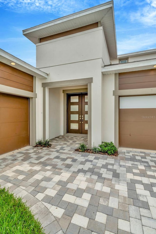 property entrance with french doors and a garage