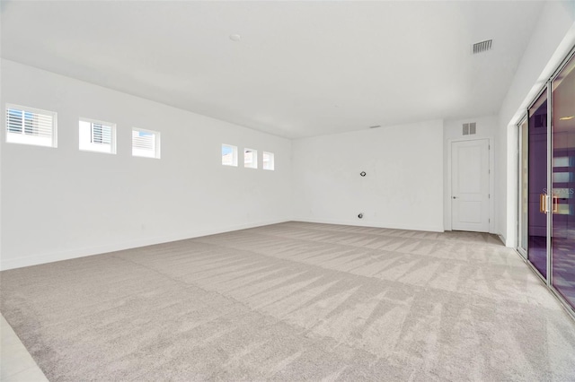 spare room with light colored carpet