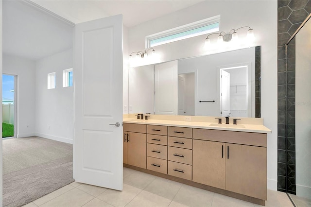 bathroom featuring vanity, tile patterned floors, and a healthy amount of sunlight