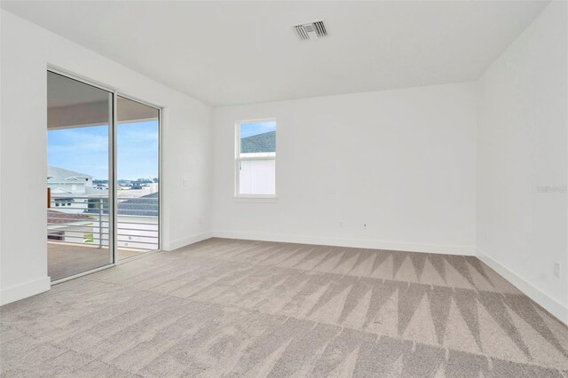 empty room with carpet flooring