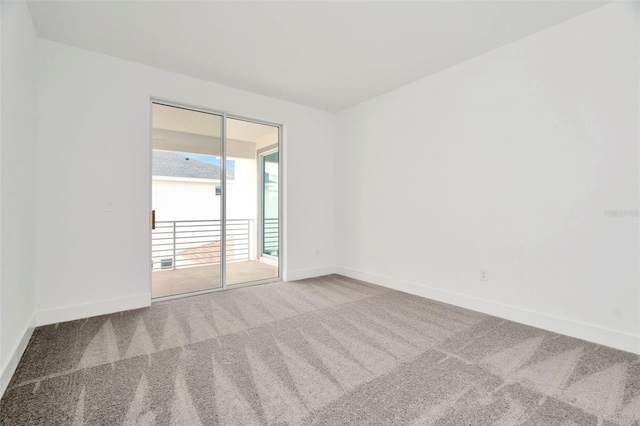 unfurnished room with carpet flooring