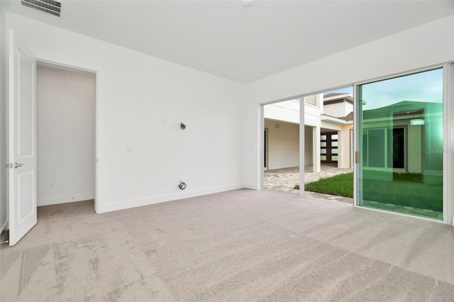 empty room with light colored carpet