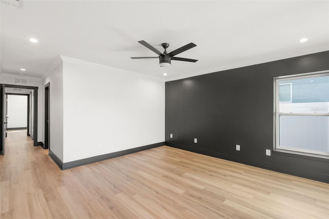 spare room with ceiling fan, light wood-type flooring, and crown molding