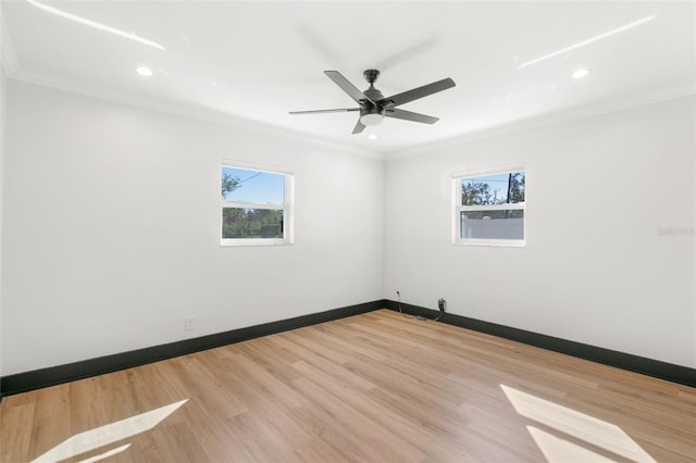 spare room with ceiling fan, light hardwood / wood-style floors, and crown molding