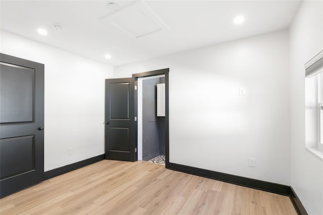 empty room with hardwood / wood-style floors