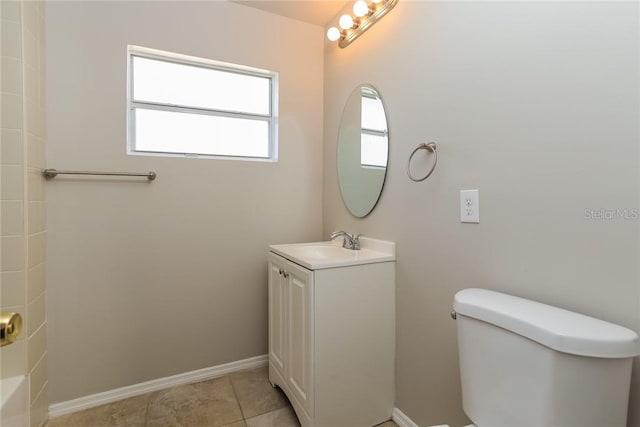 bathroom featuring tile patterned flooring, vanity, and toilet