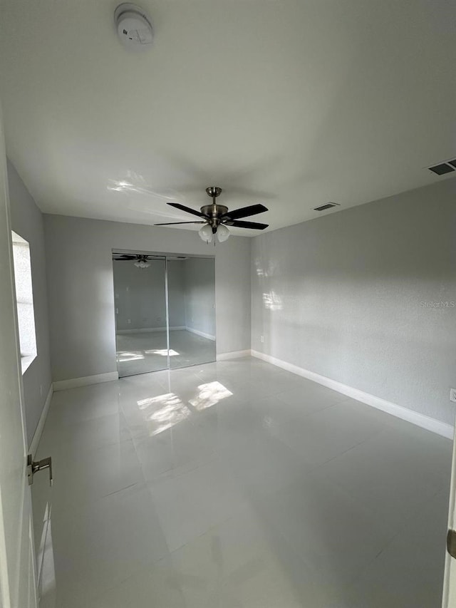 unfurnished room featuring ceiling fan