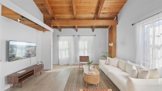 living room featuring vaulted ceiling with beams, hardwood / wood-style flooring, and wood ceiling