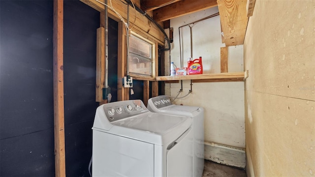 laundry area featuring washing machine and clothes dryer