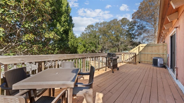 wooden deck with cooling unit and grilling area