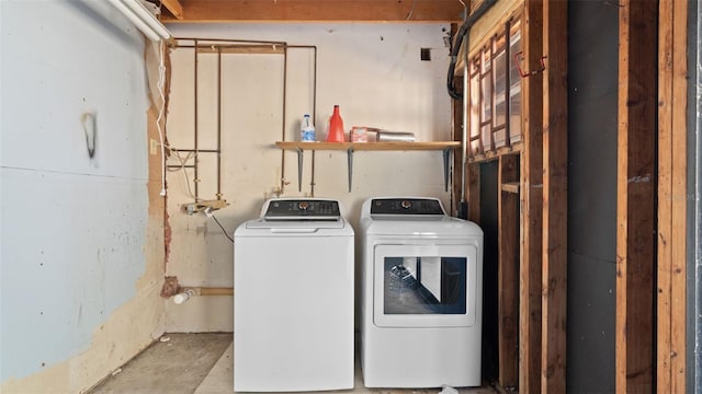 laundry room featuring washing machine and clothes dryer