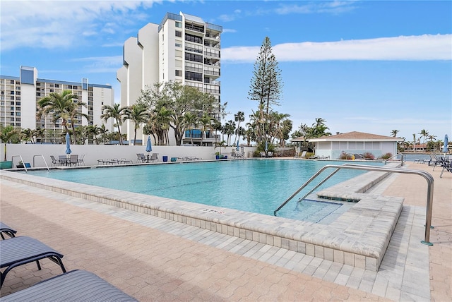 view of swimming pool with a patio area