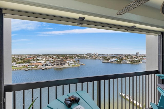 balcony featuring a water view