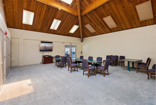 carpeted dining room featuring beamed ceiling, wooden ceiling, and high vaulted ceiling