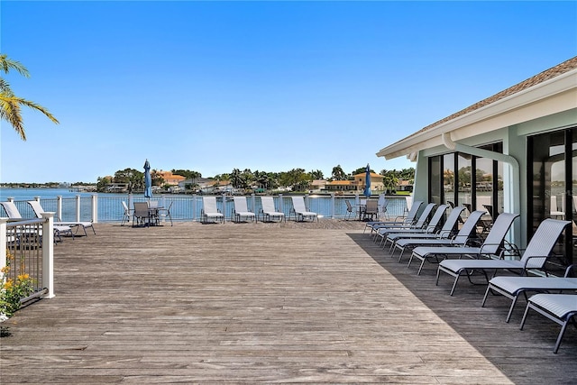 dock area featuring a deck with water view