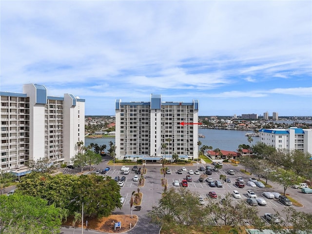 birds eye view of property with a water view