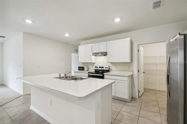 kitchen featuring sink, an island with sink, white cabinetry, and appliances with stainless steel finishes