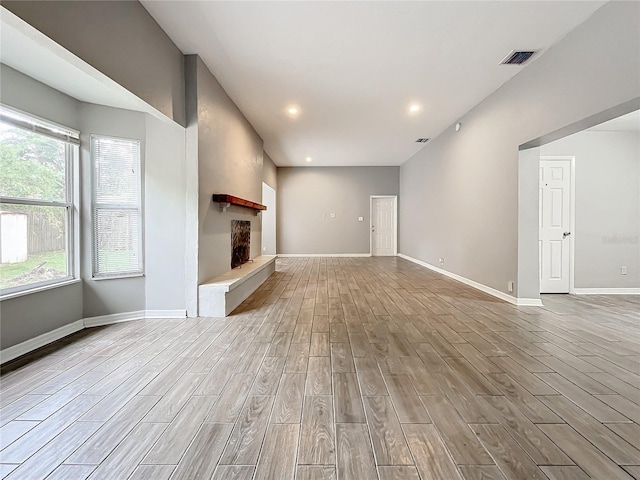 unfurnished living room with light hardwood / wood-style flooring