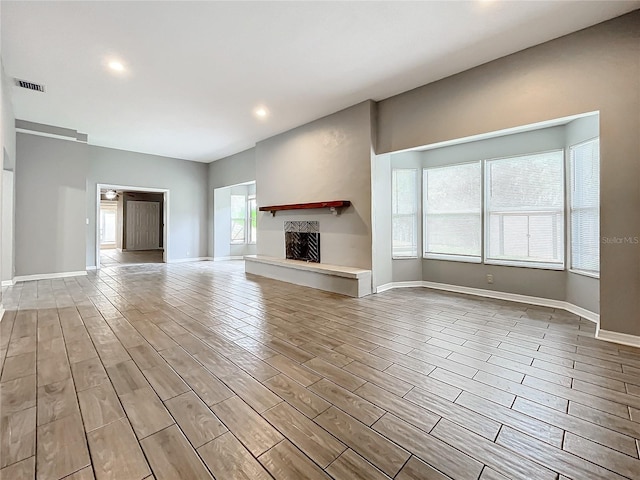 unfurnished living room with light hardwood / wood-style floors