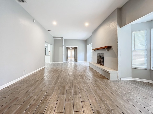 unfurnished living room with light hardwood / wood-style flooring