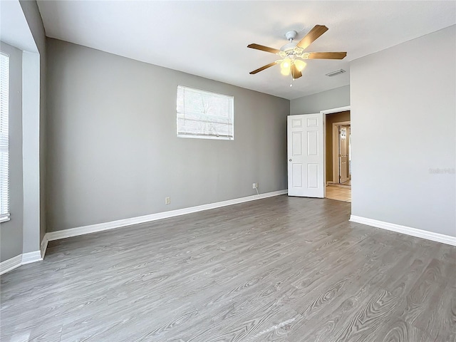 unfurnished room with ceiling fan and light hardwood / wood-style flooring