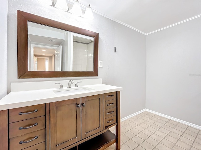 bathroom featuring tile patterned flooring, vanity, and ornamental molding