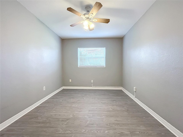 unfurnished room featuring hardwood / wood-style flooring and ceiling fan