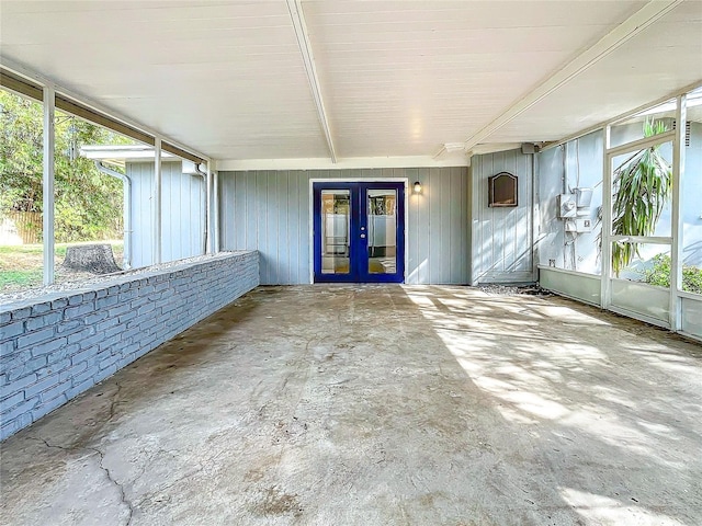 unfurnished sunroom featuring french doors