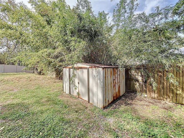 view of outbuilding with a yard