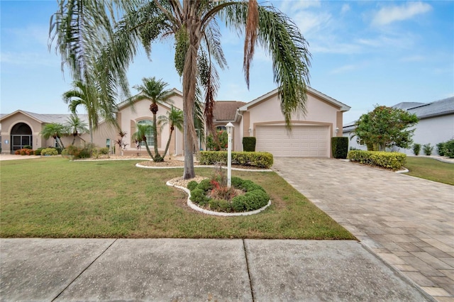 view of front facade featuring a front yard and a garage