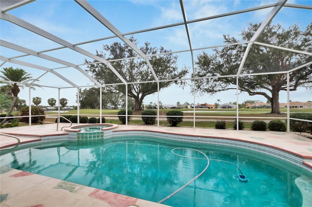 view of swimming pool featuring glass enclosure, an in ground hot tub, and a patio