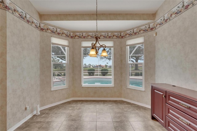 unfurnished dining area featuring an inviting chandelier