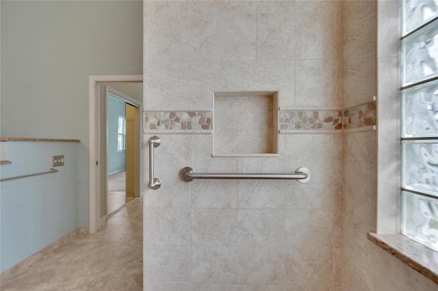 bathroom featuring tile walls