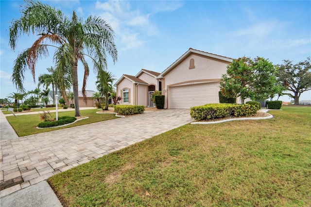 single story home with a garage and a front yard