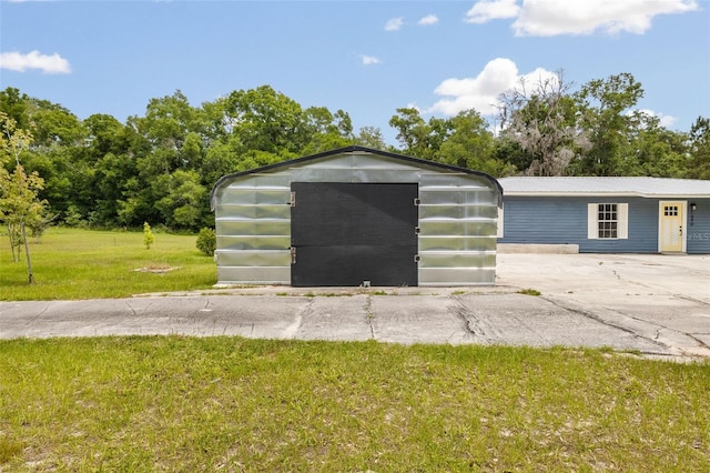 garage featuring a yard