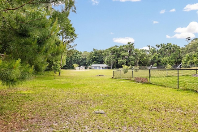 view of yard with a rural view