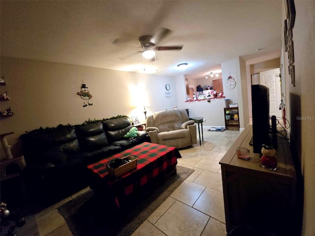 living room featuring ceiling fan and light tile patterned flooring