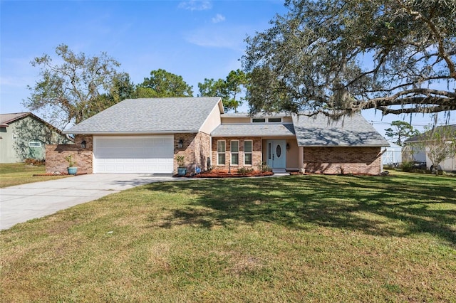 view of front of house featuring a garage and a front lawn