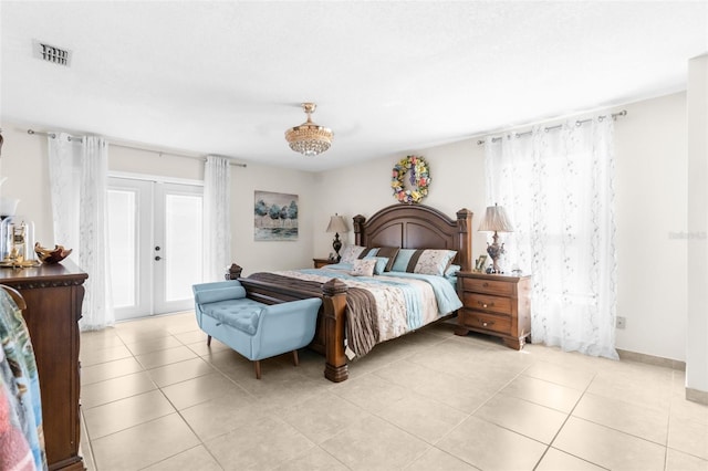 bedroom featuring light tile patterned floors and french doors